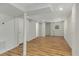 Spacious basement featuring updated flooring, neutral walls, and natural light through a window at 2126 Jernigan Se Dr, Atlanta, GA 30315