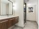 Modern bathroom featuring a floating vanity, a sleek mirror, and a glass-enclosed shower at 2126 Jernigan Se Dr, Atlanta, GA 30315