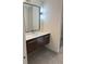 Stylish bathroom vanity with modern fixtures, quartz countertop, and frameless mirror above sink at 2126 Jernigan Se Dr, Atlanta, GA 30315