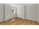 Cozy bedroom featuring hardwood floors, neutral walls, and a bright window at 2126 Jernigan Se Dr, Atlanta, GA 30315