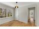 Bright bedroom with hardwood floors, large windows, and a classic pendant light fixture at 2126 Jernigan Se Dr, Atlanta, GA 30315