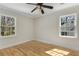 Bright bedroom with hardwood floors and two windows at 2126 Jernigan Se Dr, Atlanta, GA 30315