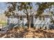 Charming exterior of gray home with landscaped front yard and steps leading to front door at 2126 Jernigan Se Dr, Atlanta, GA 30315