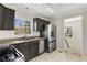 The kitchen features stainless appliances, granite countertops, and access to the staircase at 2126 Jernigan Se Dr, Atlanta, GA 30315