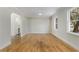 Open living room with hardwood floors and archway access to other rooms at 2126 Jernigan Se Dr, Atlanta, GA 30315