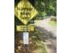 scenic walking trail sign slippery when wet at 2126 Jernigan Se Dr, Atlanta, GA 30315