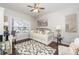 Bedroom featuring a daybed, desk, and ceiling fan at 2449 Suwanee Pointe Dr, Lawrenceville, GA 30043