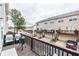 View from the deck of a townhouse including a grill, seating, and an outdoor living space at 2449 Suwanee Pointe Dr, Lawrenceville, GA 30043