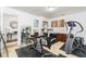 Bright exercise room featuring weight equipment, treadmill, exercise bike, and unique art decor at 2449 Suwanee Pointe Dr, Lawrenceville, GA 30043