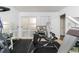 This exercise room features neutral walls, mirrored walls, storage, and carpeted floor at 2449 Suwanee Pointe Dr, Lawrenceville, GA 30043
