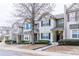 Street view of attractive townhomes featuring well-maintained landscaping and inviting covered entrances at 2449 Suwanee Pointe Dr, Lawrenceville, GA 30043