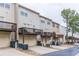 Long shot of the townhouses with individual decks over a garage at 2449 Suwanee Pointe Dr, Lawrenceville, GA 30043