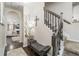 Elegant foyer features hardwood floors, staircase, stylish decor, and seamless transition to the living area at 2449 Suwanee Pointe Dr, Lawrenceville, GA 30043