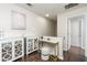 Hallway features a small table, cabinets, and dark wood floors at 2449 Suwanee Pointe Dr, Lawrenceville, GA 30043