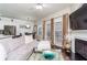 Open-concept living area featuring modern kitchen, dining space, and fireplace at 2449 Suwanee Pointe Dr, Lawrenceville, GA 30043
