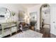 Elegant living area showcases modern decor, hardwood floors, and seamless transition to other spaces at 2449 Suwanee Pointe Dr, Lawrenceville, GA 30043