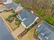 Aerial view showcasing the landscaped yard and the roof of the charming single-Gathering home at 455 Ellesmere Way, Buford, GA 30518