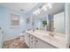 Bright bathroom with a double vanity, a large mirror, and tile flooring at 455 Ellesmere Way, Buford, GA 30518