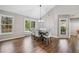 Bright dining area with hardwood floors, neutral paint, and large windows offering great views at 455 Ellesmere Way, Buford, GA 30518