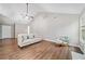 Living room with natural lighting and hardwood floors at 455 Ellesmere Way, Buford, GA 30518