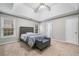 Spacious main bedroom with a tray ceiling and a seating area at 455 Ellesmere Way, Buford, GA 30518