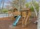 Community playground featuring a slide, climbing structures, and a swing set at 455 Ellesmere Way, Buford, GA 30518