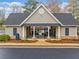 Community pool house with gated entry, seating, and views of the pool at 455 Ellesmere Way, Buford, GA 30518