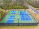 Community tennis and pickleball courts, lined and ready for play, with lighting for evening games at 455 Ellesmere Way, Buford, GA 30518