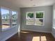 Bright bedroom with hardwood floors and large windows offering beautiful views at 871 Pineberry Ct, Grayson, GA 30017