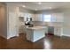 Modern kitchen with white cabinetry, stainless steel appliances, and an island at 871 Pineberry Ct, Grayson, GA 30017