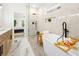 Spa-like bathroom with a freestanding tub, modern fixtures, and a glass-enclosed shower at 1288 Gate Post Ln, Powder Springs, GA 30127