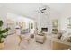 Bright and airy living room with a marble fireplace, cathedral ceiling, and an open-concept kitchen at 1288 Gate Post Ln, Powder Springs, GA 30127