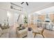 Spacious open-concept living area with high ceilings, modern furnishings, and a view of the staircase at 1288 Gate Post Ln, Powder Springs, GA 30127