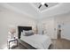 Main bedroom showcasing a tray ceiling with integrated lighting and en-suite bathroom at 1288 Gate Post Ln, Powder Springs, GA 30127