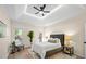 Cozy main bedroom featuring a trey ceiling, a walk-out to a deck, and a comfortable seating area at 1288 Gate Post Ln, Powder Springs, GA 30127