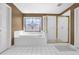 Bathroom featuring a soaking tub, a shower, and tiled floors at 1621 Telfair Chase Way, Lawrenceville, GA 30043