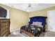 Bedroom featuring neutral walls, carpet, ceiling fan, plus a padded headboard and footboard at 1621 Telfair Chase Way, Lawrenceville, GA 30043