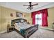 Bedroom featuring neutral walls, carpet, a bed with a decorative headboard and matching side tables at 1621 Telfair Chase Way, Lawrenceville, GA 30043