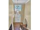 Grand foyer with a stunning chandelier, hardwood floors, and view of the front door and staircase at 1621 Telfair Chase Way, Lawrenceville, GA 30043