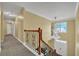 Elegant foyer featuring stairs with decorative iron railing and a chandelier at 1621 Telfair Chase Way, Lawrenceville, GA 30043