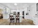 Modern kitchen featuring white cabinets, an island with bar seating, and stainless steel appliances at 1621 Telfair Chase Way, Lawrenceville, GA 30043