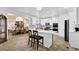 Bright kitchen features white cabinets, stainless steel appliances, and adjacent dining area at 1621 Telfair Chase Way, Lawrenceville, GA 30043