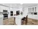 Well-lit kitchen with white cabinetry, stainless steel appliances, and stylish backsplash at 1621 Telfair Chase Way, Lawrenceville, GA 30043