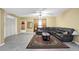 Inviting living room with a comfortable sectional sofa, patterned rug, and neutral decor at 1621 Telfair Chase Way, Lawrenceville, GA 30043