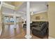 Bright living room with a seating area, decorative columns, and multiple windows at 1621 Telfair Chase Way, Lawrenceville, GA 30043