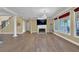 Spacious living room featuring a fireplace, hardwood floors, and elegant architectural details at 1621 Telfair Chase Way, Lawrenceville, GA 30043