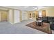 Spacious living room with a black sectional sofa, decorative rug, and neutral decor at 1621 Telfair Chase Way, Lawrenceville, GA 30043
