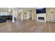 Open living area with hardwood floors, fireplace, and ample space for entertaining at 1621 Telfair Chase Way, Lawrenceville, GA 30043