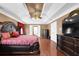 Spacious main bedroom with a decorative ceiling, hardwood floors, and ample closet space at 1621 Telfair Chase Way, Lawrenceville, GA 30043