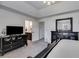 Main bedroom has tray ceilings and adjoins an ensuite bathroom and walk-in closet at 245 Raleigh Way, Villa Rica, GA 30180